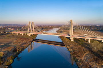 Obraz premium Double cable-stayed bridge in Krakow, Poland over the Vistula river at sunrise