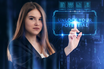 Business, Technology, Internet and network concept. Young businessman working on a virtual screen of the future and sees the inscription: Unlock your potential
