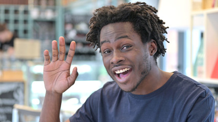 Waving African Man doing Video Chat, Webcam View