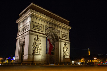 Fototapeta na wymiar Arc de Triomphe of Paris on Charles de Gaulle Square at night