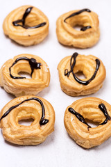 Tasty Home Baking Eclair with Cottage Cheese and Chocolate Sauce Tasty Homemade Dessert Top View Flat Lay Vertical