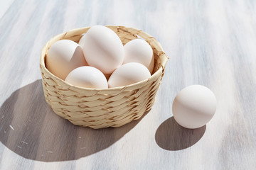 Organic white eggs in basket