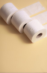 Toilet paper on 3 pieces background