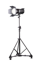 Photography studio flash on a lighting stand isolated on white background.