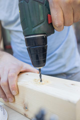 Construction Worker Using Drill To wood