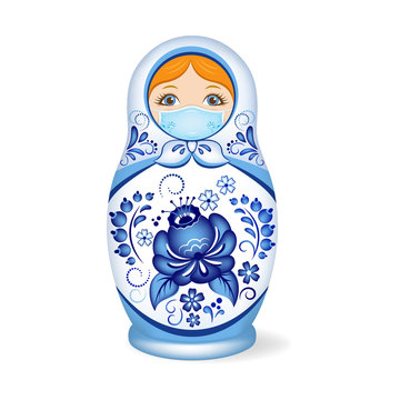 Russian wooden nesting doll wearing a face mask. Babushka or Matryoshka. Decorated with Gzhel, Russian traditional painted floral pattern. 