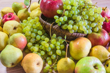 Ripe apples, pears and grapes background