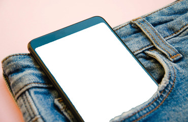 White screen smartphone in jeans pocket. Smartphone place for text. Smartphone in a pocket on a...