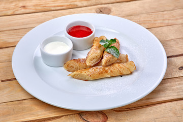 pancakes with sour cream and berry sauce