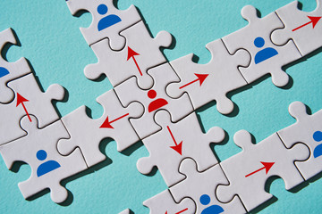 Puzzle pieces as an example of the spread of the virus between people in their interaction.