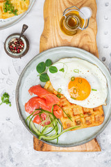 Fototapeta na wymiar potato savory waffles with salmon, egg and caviar