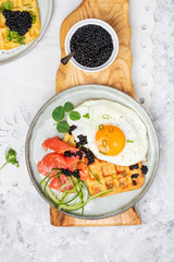 potato savory waffles with salmon, egg and caviar