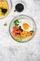 potato savory waffles with salmon, egg and caviar