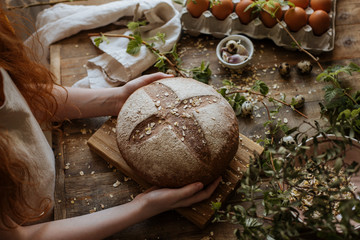 Hot rye bread on a wooden table
