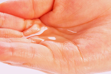 Fototapeta premium put water on one's hand.