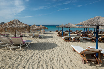 Beach chairs and umbrellas on an empty beach. Closed season 2020. 