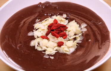 Chocolate Pudding Garnished with Almonds and Goji Berries