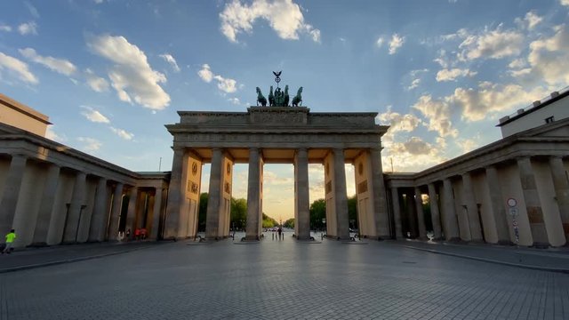 Empty Brandenburg Gate Establishing Shot in Berlin, Germany with No People at Golden Hour Sunset during Corona Virus COVID-19 Pandemic