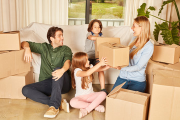 Family moving between moving boxes