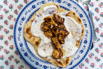 Greek Pita Chicken Souvlaki Kalamaki wrap opened with Tzatziki yogurt sauce, chicken skewers, red onion and tomato.
Traditional greek street food.