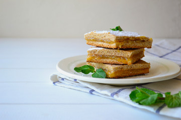 Thin whole grain vegan pie with zest filling and mint leaves.