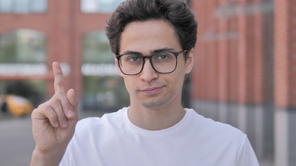 Outdoor Portrait of Young Man Rejecting Offer