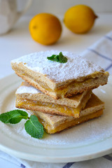 Whole grain thin pie with lemon jam on a white background.