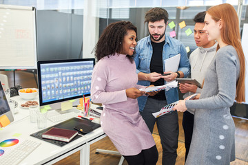Start-up team discusses a web design project