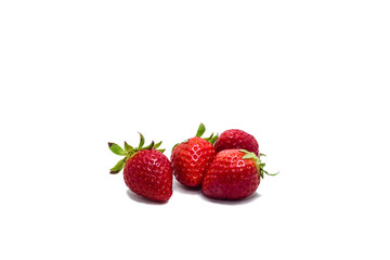 Fresh strawberries closeup isolated on white background.
