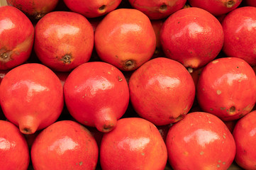 Fruits of Pomegranate, Punica granatum, family Lythraceae with juicy seeds inside. Fruits for sale at New Market area , Kolkata , West Bengal, India.