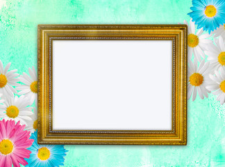 Vintage gold frame on green background with chamomile and gerber, festive background, free space for your design