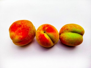 peaches on a white background as a concept food pictures 