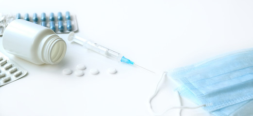 Medical topic. banner on white background with space for text. blue and white pills in package next...