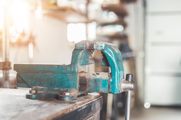 Vice workshop concept: Close up of a blue, metal vice