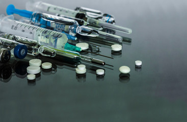 Thermometer, pills, injection vaccine ampoules, syringe for vaccination on glass background, Coronavirus, Wuhan coronavirus 2019-nCoV,concept of Corona virus quarantine,Covid-19.