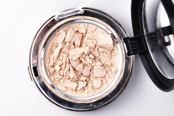 Shattered Foundation Compact in a Container.
