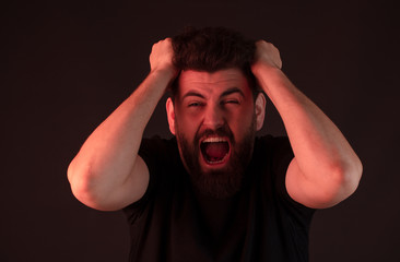 Male adult, stressed depressed, mental problem difficulty, medical concept. man having psychological seizure under red light.