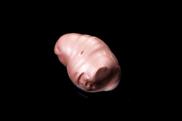 Pearl Foundation Cream Stroke and Texture on Black Background.