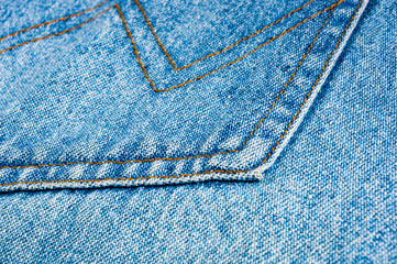 clothing items blue stonewashed faded jeans cotton fabric texture with seams, clasps, buttons and...