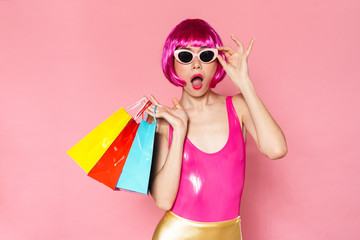 Image of surprised girl holding shopping bags