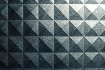Grunge pyramid pattern background with light