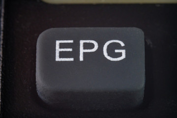 Extreme cloesup of a EPG button on a TV remote