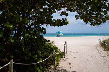 Empty Miami beach. Quarantine during a pandemic coronavirus. South Beach, Miami Beach closed, Florida US with lifeguard tower and coastline without people. City of Miami closed all beaches 2020.