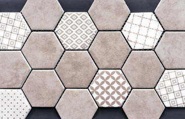Beige ceramic tile in the form of honeycombs. Hexagonal floor tiles.