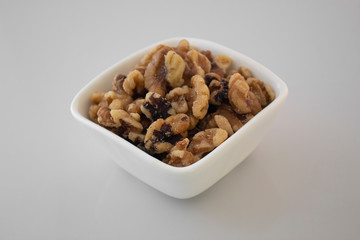 white cup with walnuts