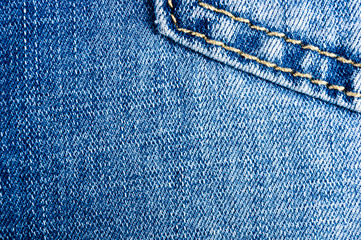 clothing items blue stonewashed faded jeans cotton fabric texture with seams, clasps, buttons and...