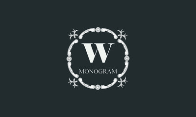 Fototapeta premium Exquisite floral monogram with letter W. Magnificent three-dimensional logo. Elegant frame for business sign, label, boutique brand, hotel, restaurant, heraldry.