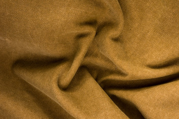 clothing items stonewashed cotton fabric texture with seams, clasps, buttons and rivets, macro