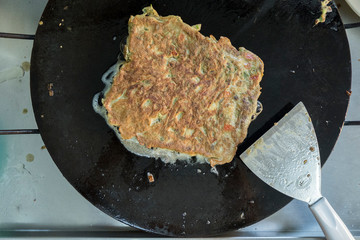 "Murtabak" or pancake with mixed meat or chicken and vegetable is cooking