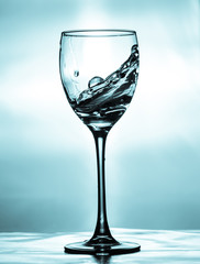 glass of water on blue background